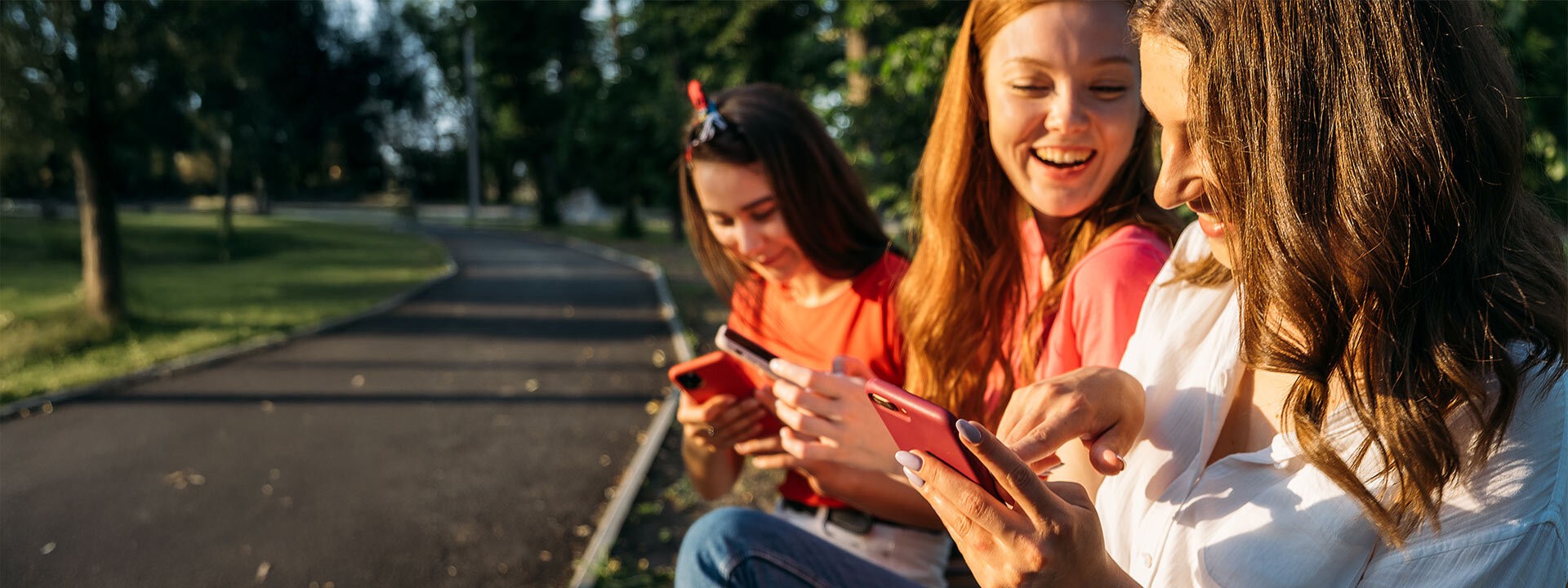 group of girls looking at phone