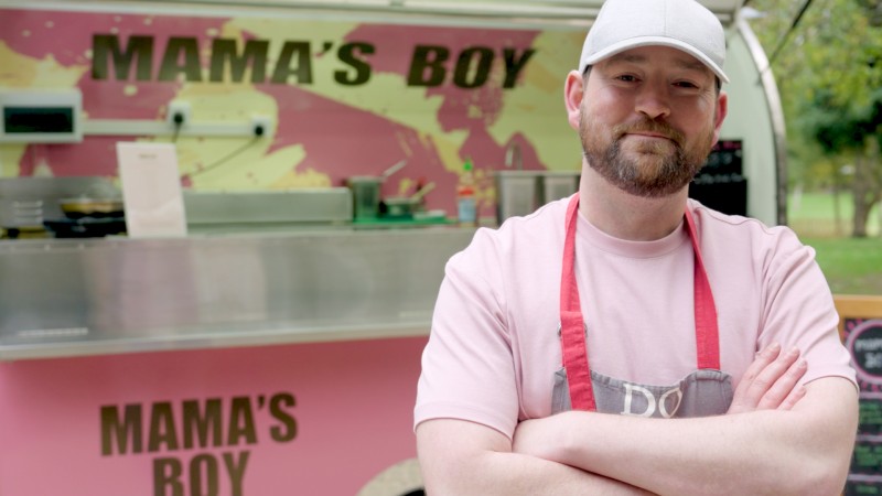 merchant in front of mamas boy shop